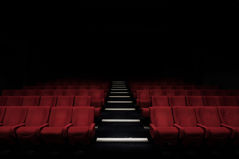 Empty Movie Theater With Red Seats