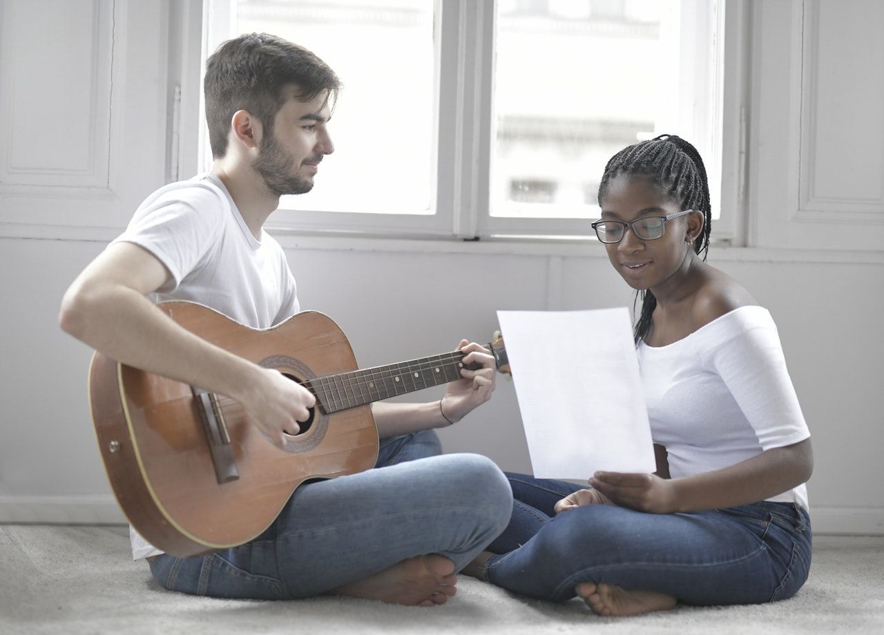 couple playing music in living room