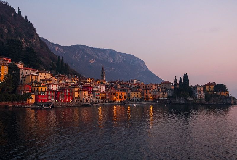 A picturesque Italian town on Lake Como, with a backdrop of mountains