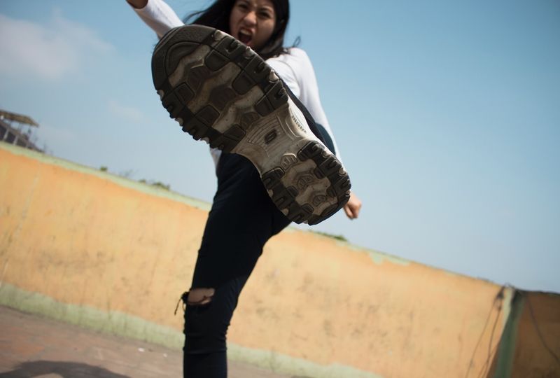 Girl kicking air