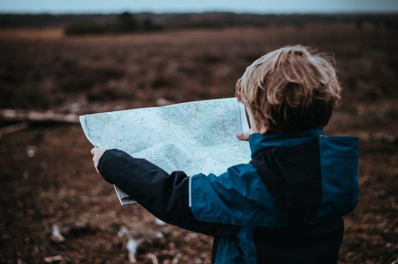 Boy Holding a Map