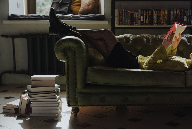 person reading on couch