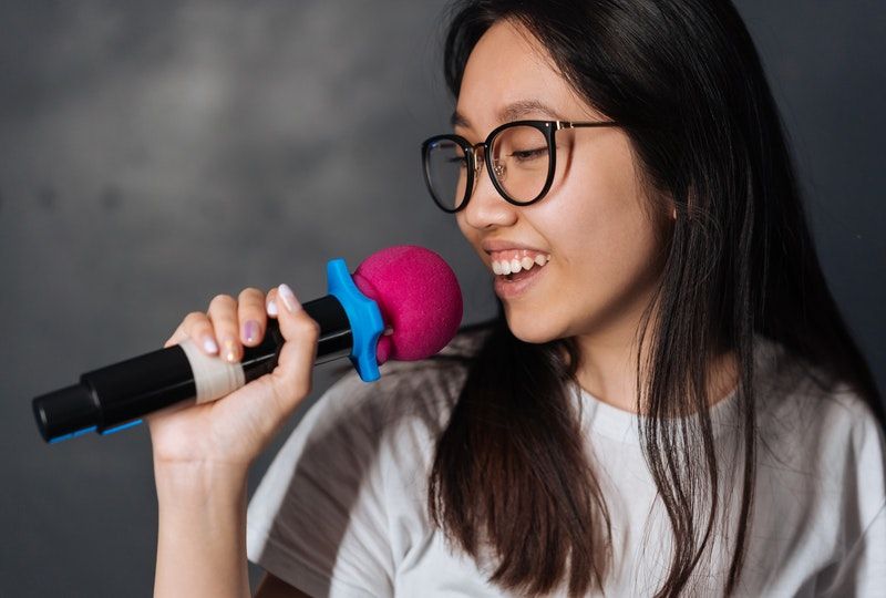 person singing into microphone