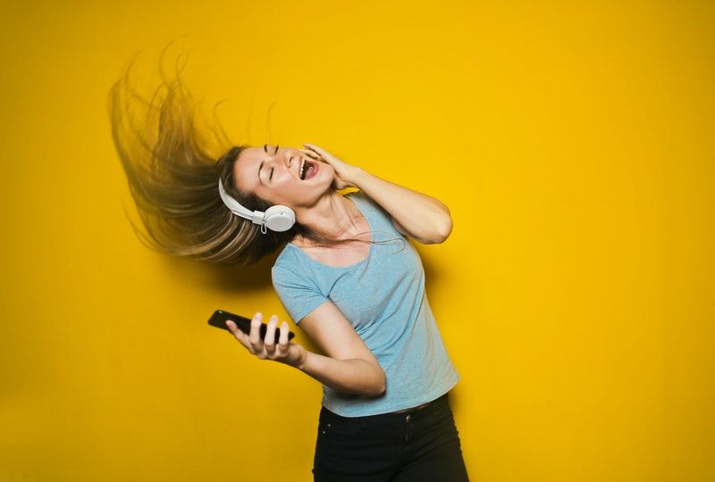 woman dancing listening to music