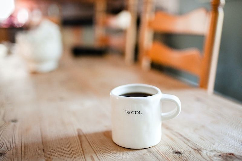Coffee cup with words "Begin"