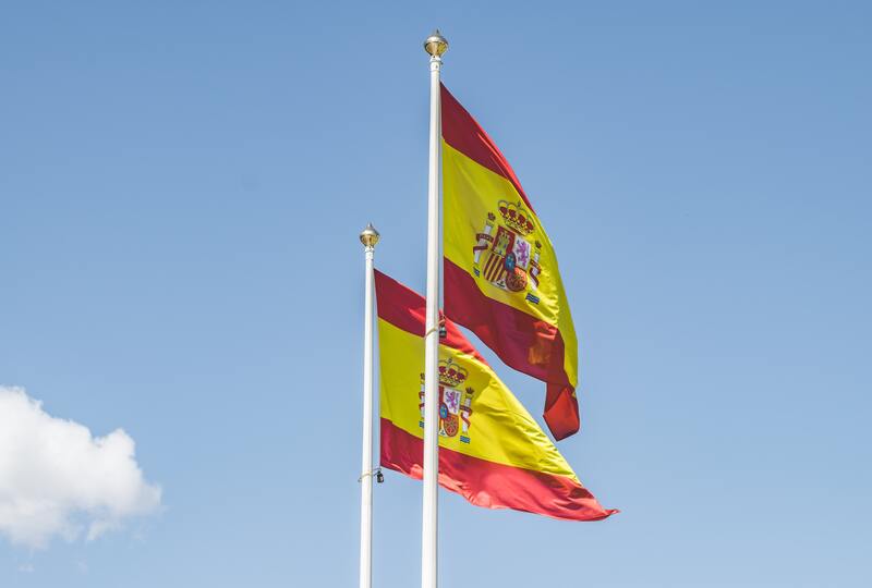 Two Spanish flags floating in the wind