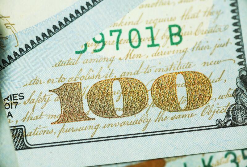 100 dollar bill written in gold