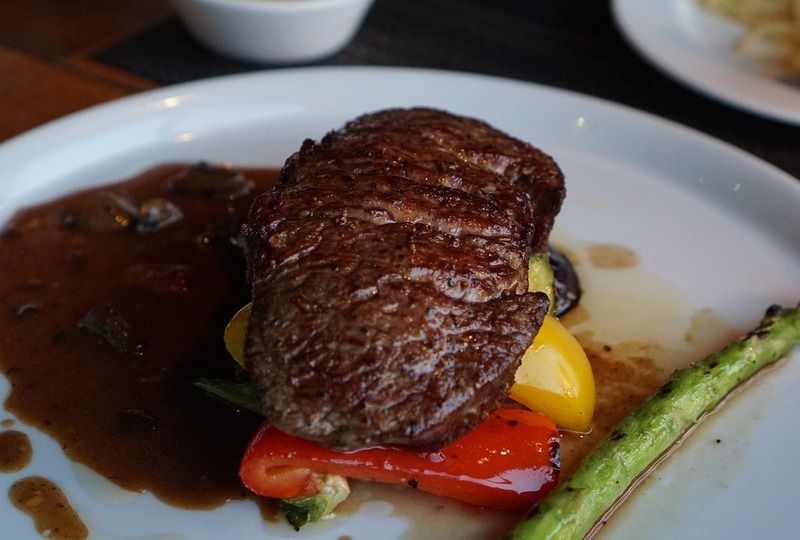 A steak on a white plate
