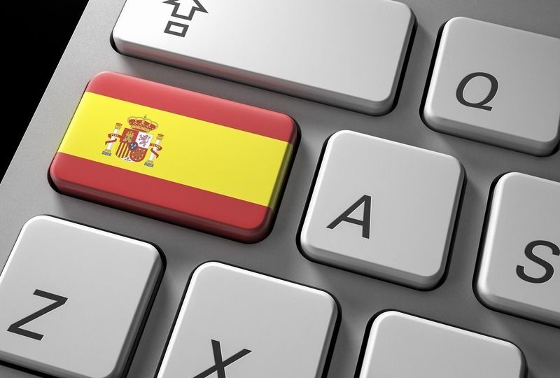 Keyboard with a key that has the Spanish flag on it