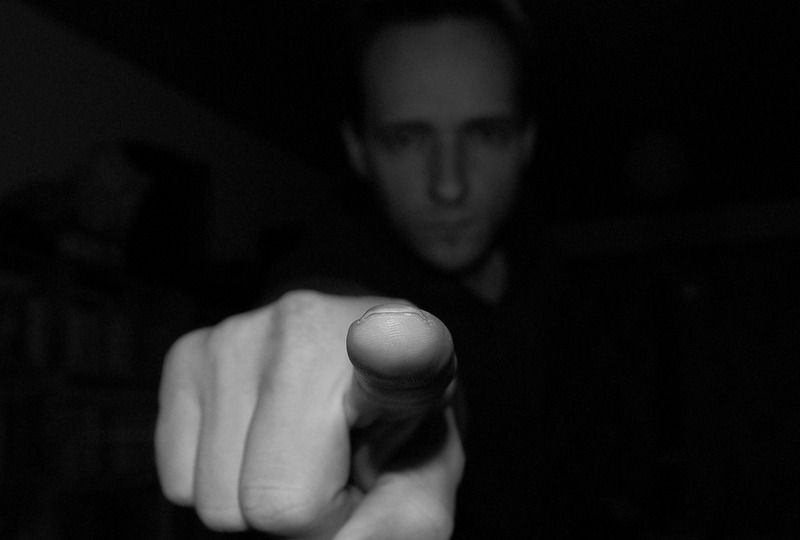 Man pointing to the camera in black and white