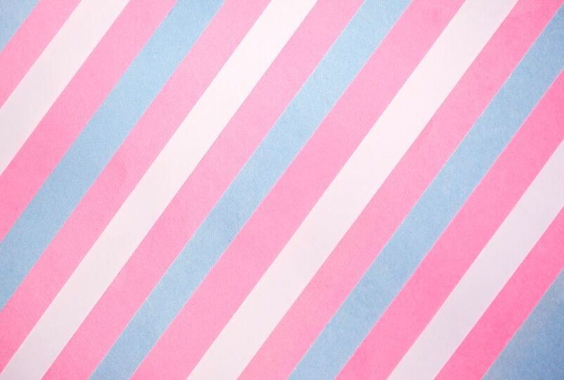Diagonal blue, pink, and white stripes