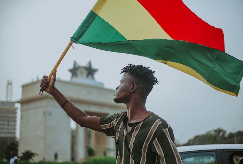 Young man holding pan-African flag