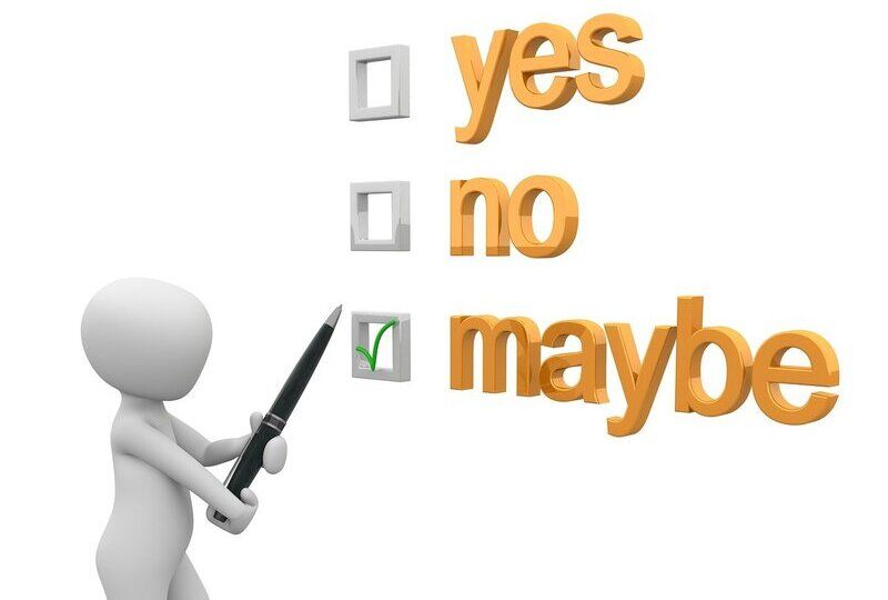 A person checking off a box that says 'maybe' with two other boxes that say 'yes' and 'no'