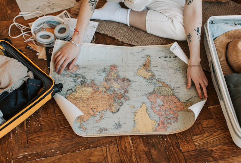 Person looking at a world map.