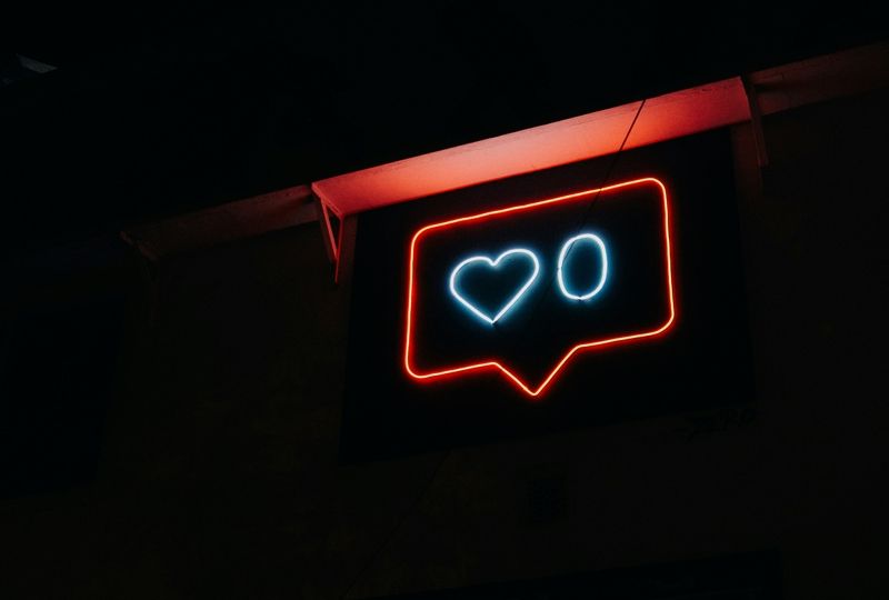 social media like sign in neon lights