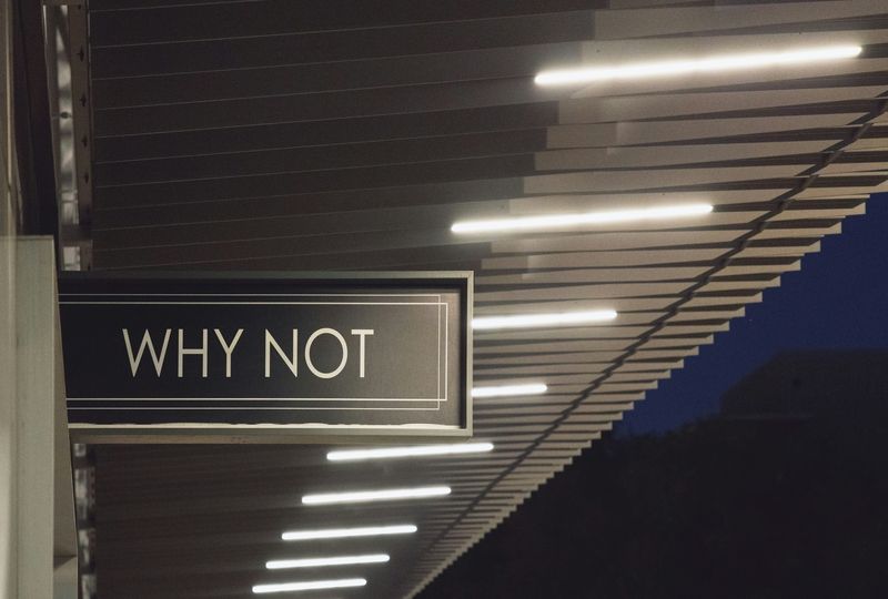a subway sign saying why not