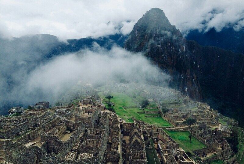 Machu Picchu behind mist