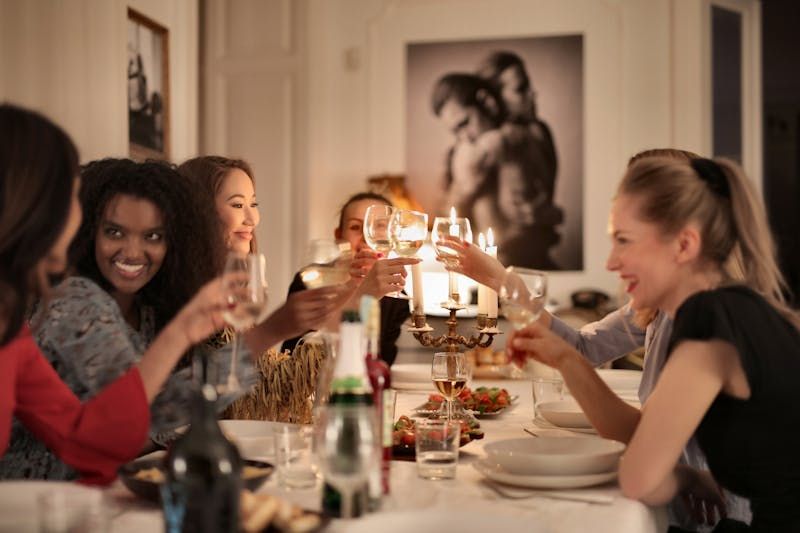 Group of women celebrating and talking.