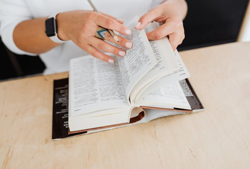 Person scrolling through a book