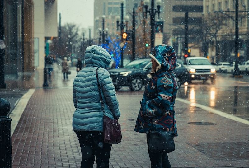 People standing in bad weather.