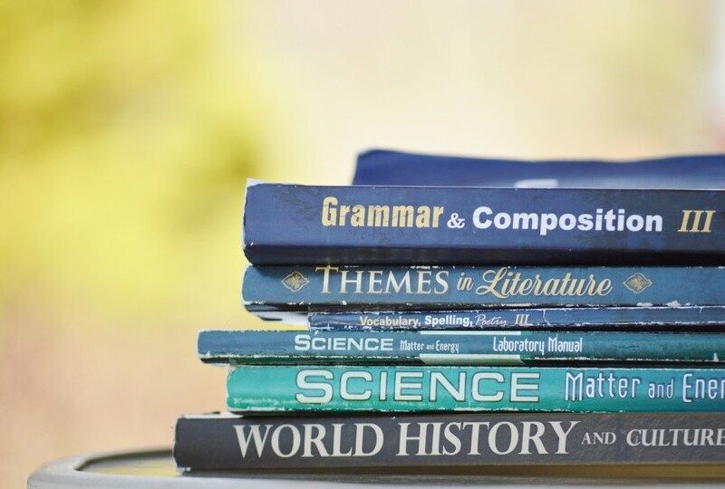 A stack of books about grammar and other academic subjects