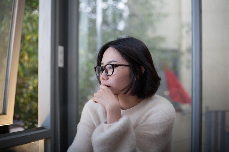 Person wondering at computer.