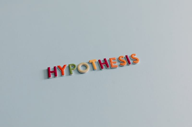 Colorful letters spelling out hypothesis.