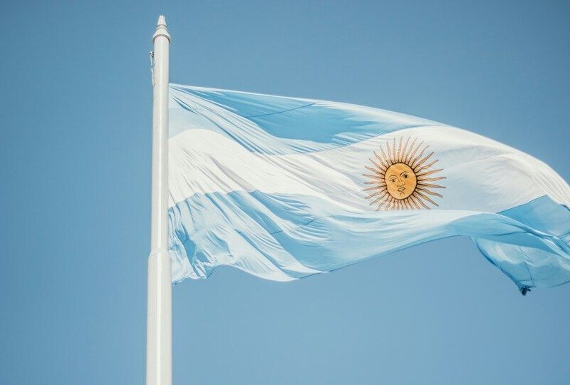 The Argentinean flag on a blue sky backdrop